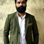 Indian journalist with beard neatly trimmed